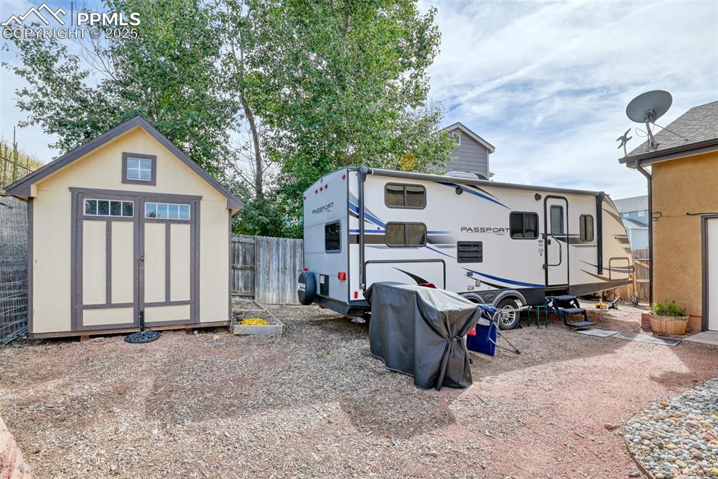 Image 49 of 49: View of yard featuring a storage shed