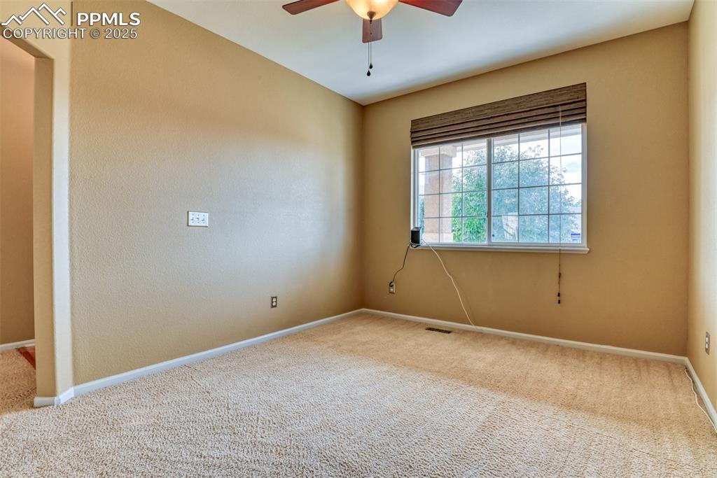 Image 9 of 49: OFFICEwith a ceiling fan and a textured wall