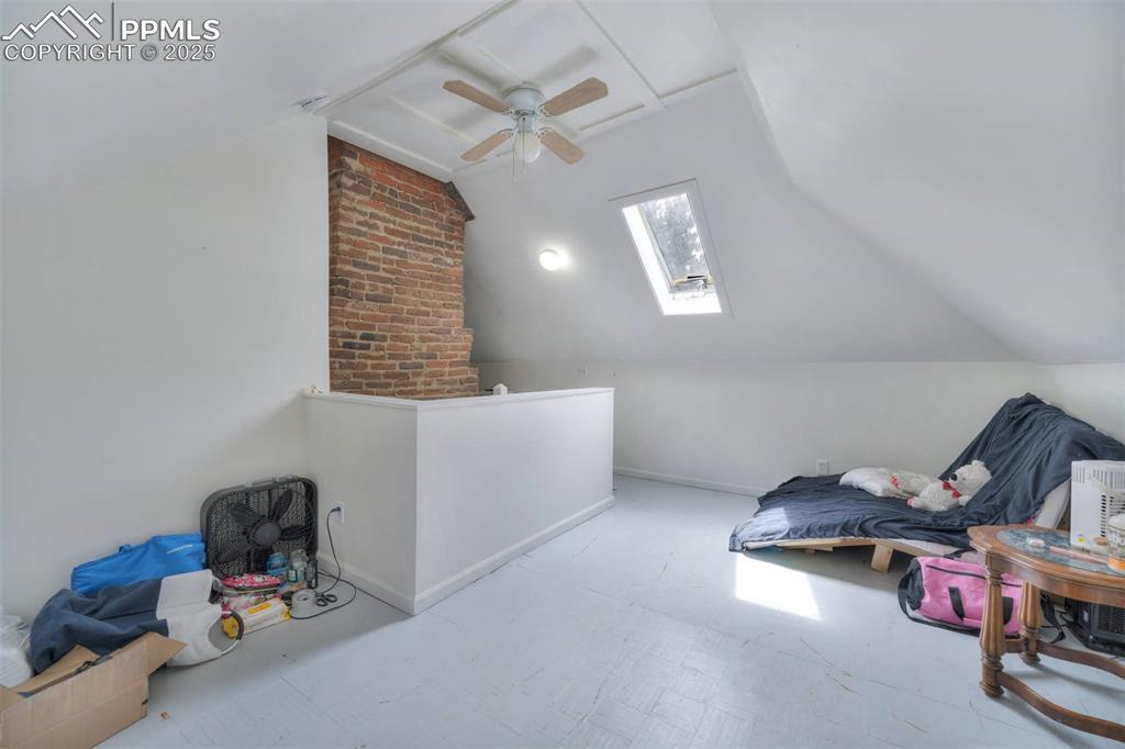 Image 11 of 38: The open space has two sides and a skylight. 