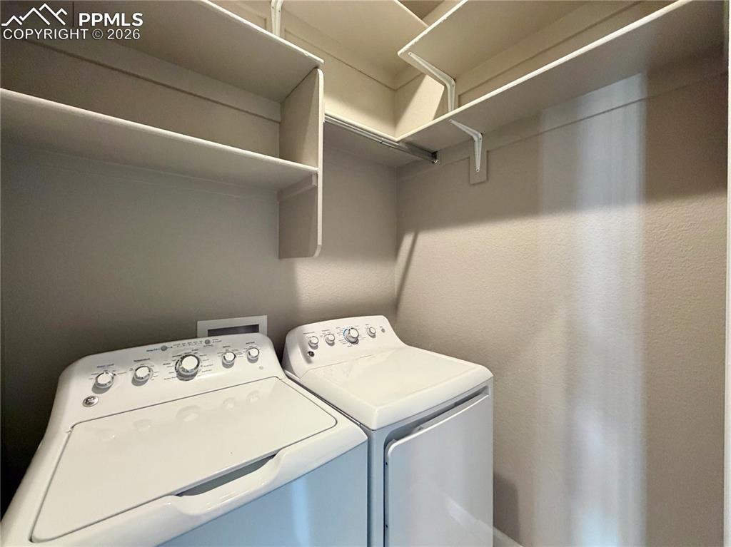 Image 24 of 42: Additional Shelving in Laundry, Washer and Dryer included. 