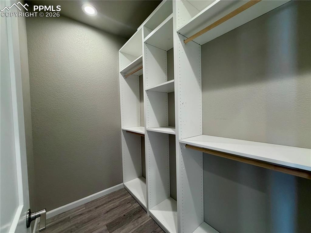 Image 9 of 42: Wood Shelving System in Closet