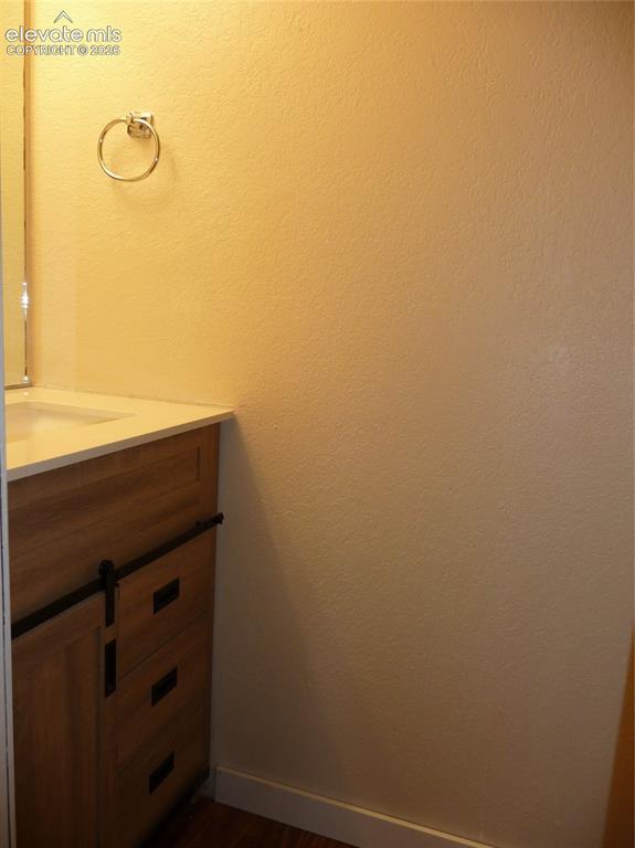 Image 12 of 18: Lower level powder room (no bath or shower)