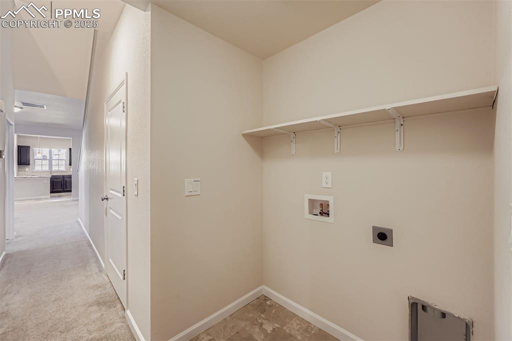 Image 25 of 30: Laundry area featuring washer hookup, light carpet, and electric dryer hook