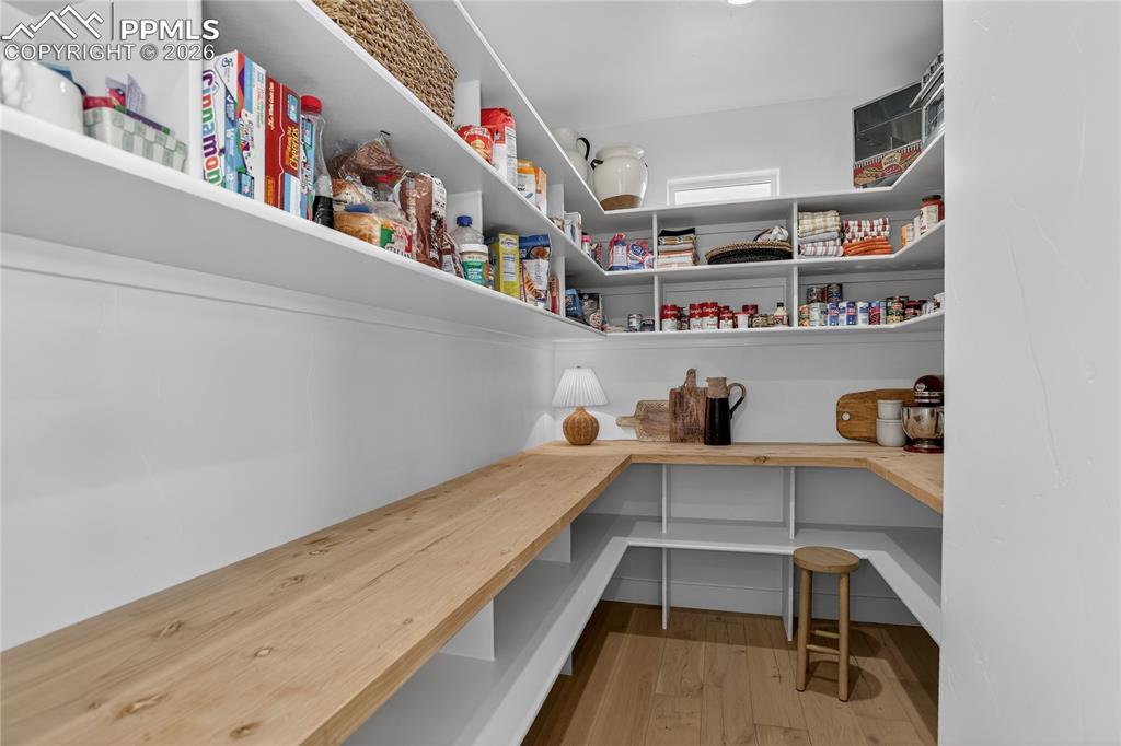 Image 13 of 49: Huge walk-in pantry