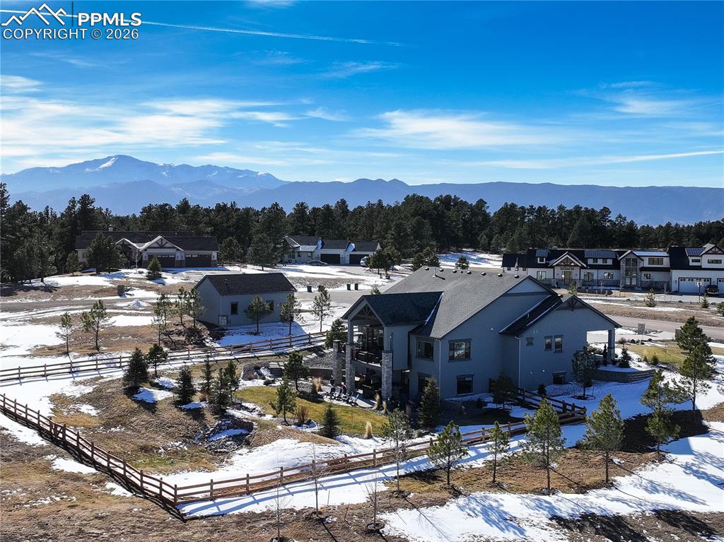Image 2 of 49: Extensively landscaped backyard with detached 4-car garage & Pikes Peak in 