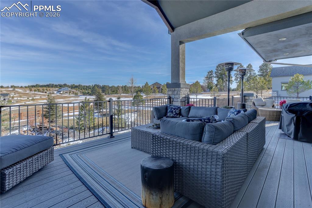 Image 41 of 49: Main-level covered composite deck area