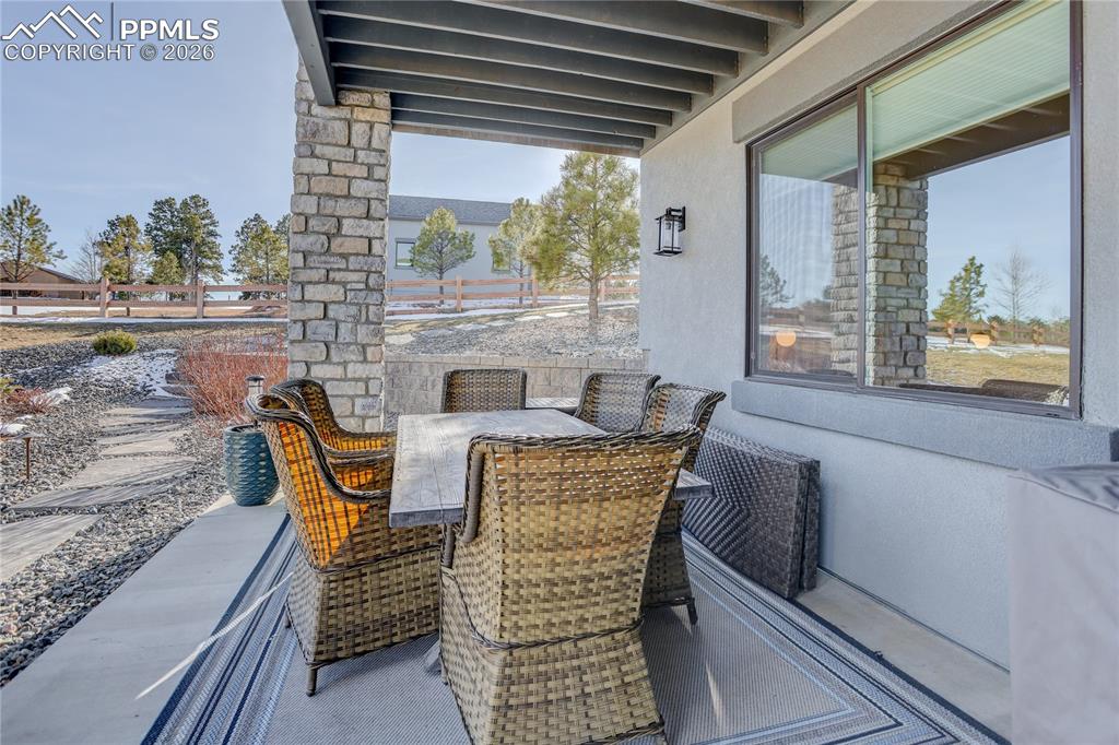 Image 43 of 49: Lower-level covered patio area