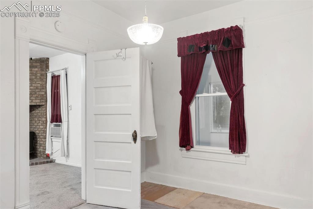 Image 10 of 24: Unfurnished room featuring baseboards and light colored carpet