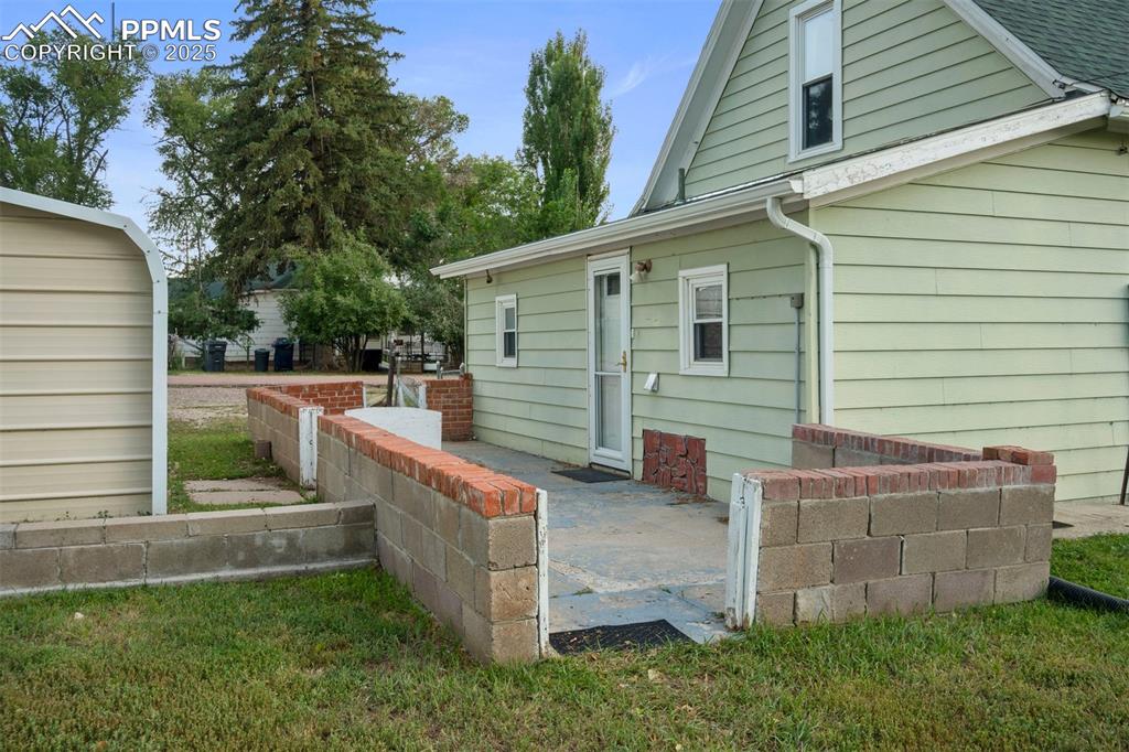 Image 21 of 24: Rear view of house featuring a patio