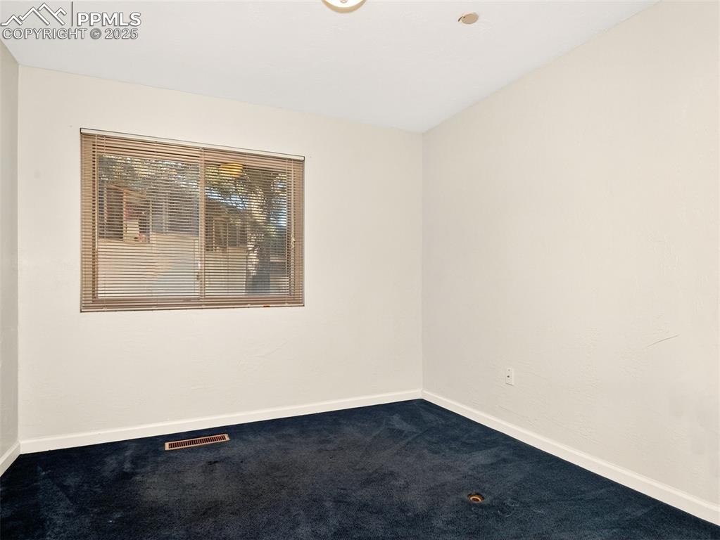 Image 16 of 17: Carpeted empty room with baseboards