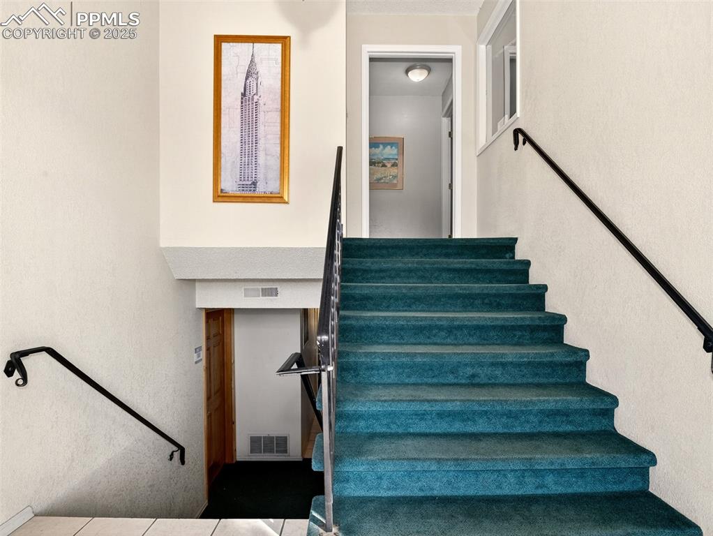 Image 5 of 17: Stairs with a textured wall