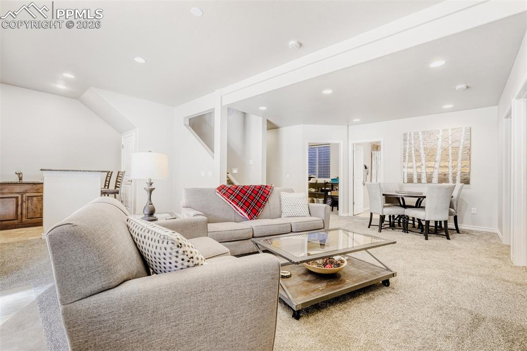 Image 28 of 47: Basement Living area with game area and complete wet bar