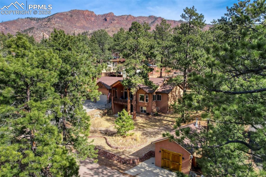 Image 42 of 47: View from above of property featuring mountains