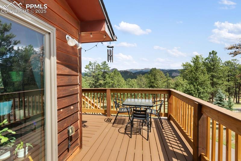 Image 12 of 37: Wooden deck with outdoor dining space