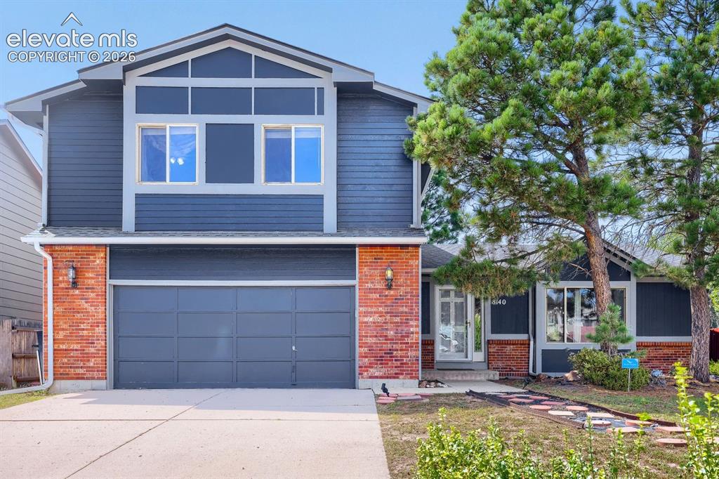 Image 1 of 42: Two-story exterior with siding and brick accents