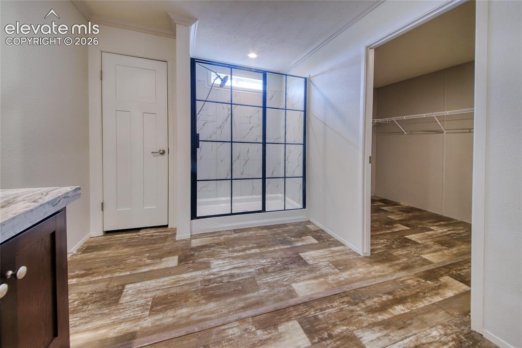 Image 13 of 50: Master bedroom walk in closet