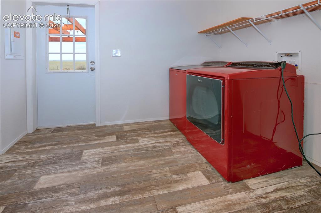 Image 24 of 50: Laundry walks out to patio and appliances are included with home
