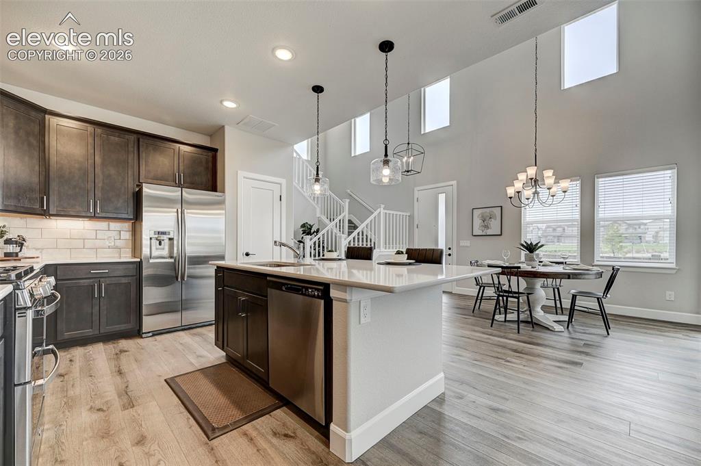 Image 11 of 37: Upper windows keep the home flooded with natural light. 