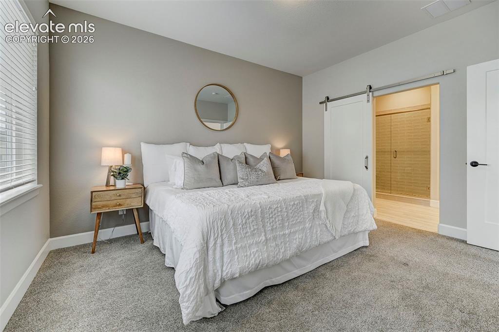Image 17 of 37: The primary bedroom has an ensuite bath.