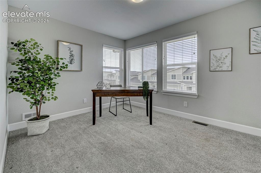 Image 28 of 37: The second bedroom upstairs has some of the best Pikes Peak views you