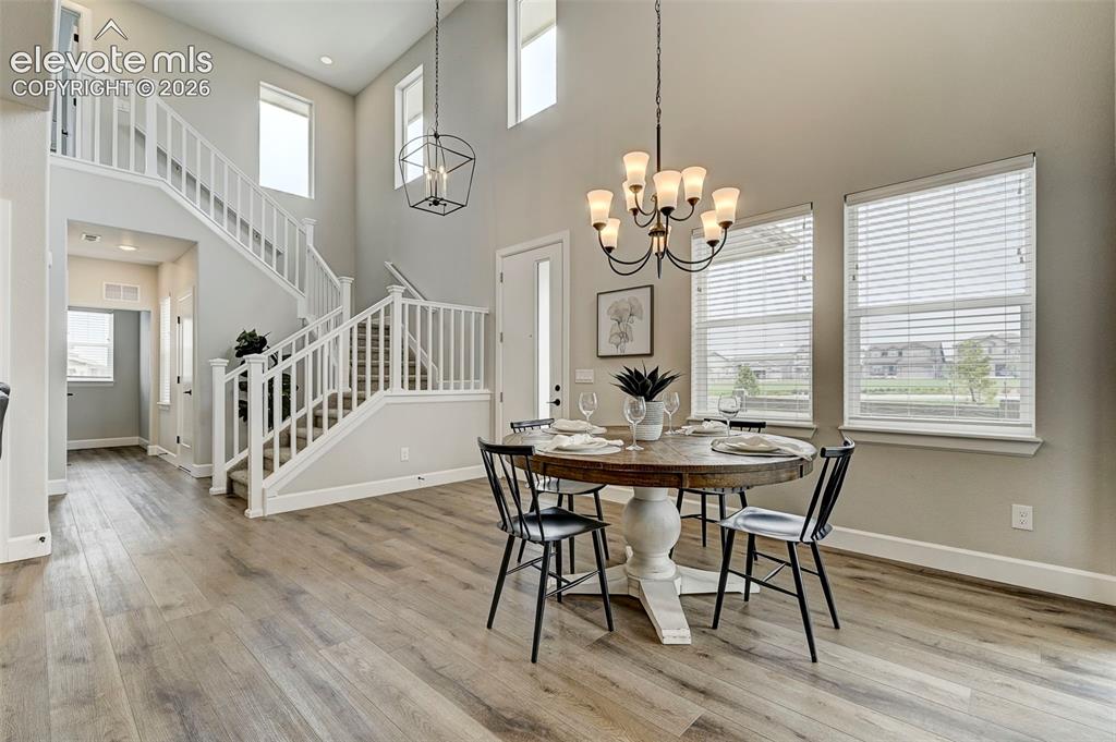 Image 3 of 37: High ceilings, abundant windows and elegant staircase give this home a grea