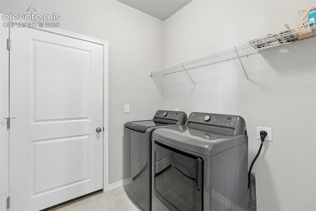Image 22 of 35: Washer and dryer included; space for cabinets or shelving.
