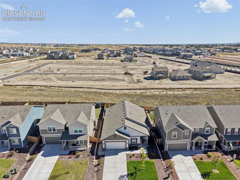 Image 6 of 35: Home backs to a utility easement, that cannot be built on.