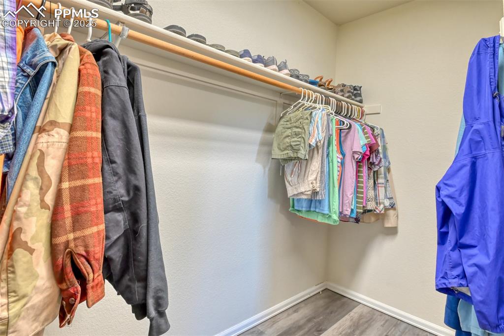 Image 26 of 43: Spacious closet featuring new flooring in the primary bedroom