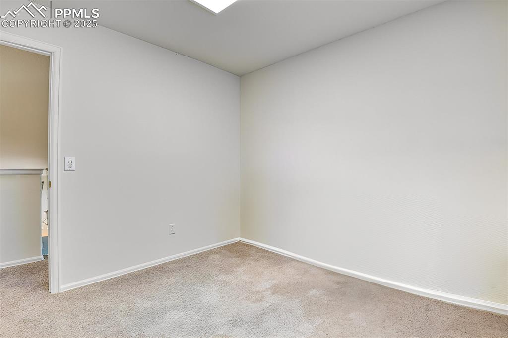 Image 34 of 43: Empty room featuring carpet floors and baseboards
