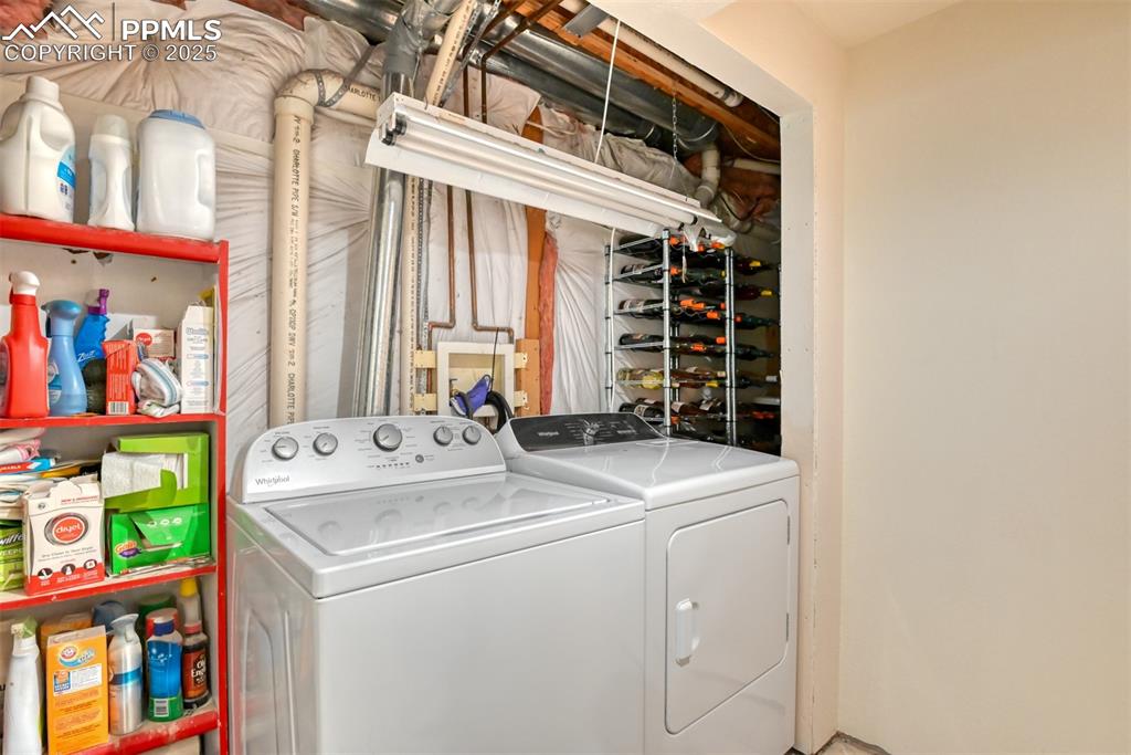 Image 38 of 43: Laundry area with newer washer and dryer in the basement