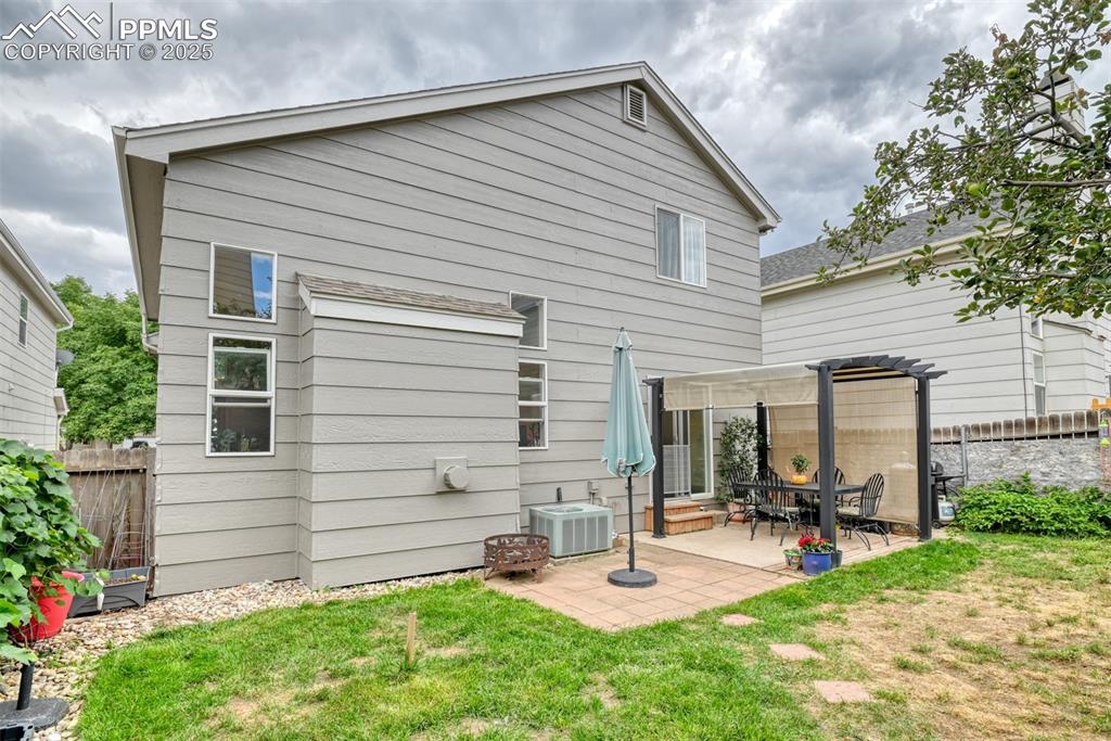 Image 42 of 43: Back of house with a patio