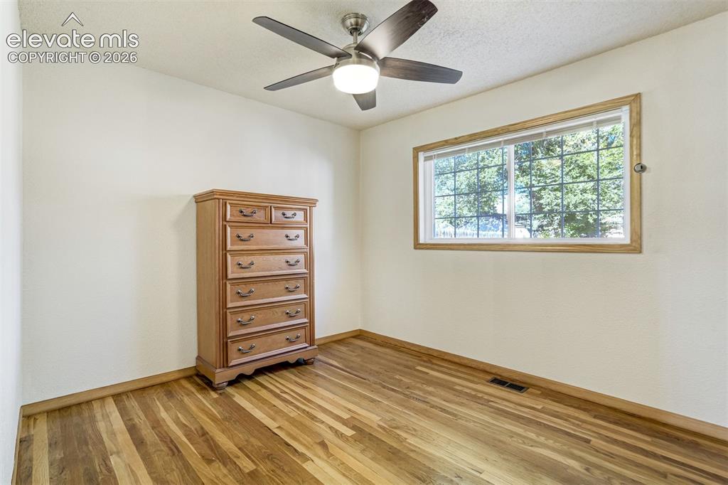 Image 14 of 31: Wood-finish flooring with perimeter trim, single window with wood framing,