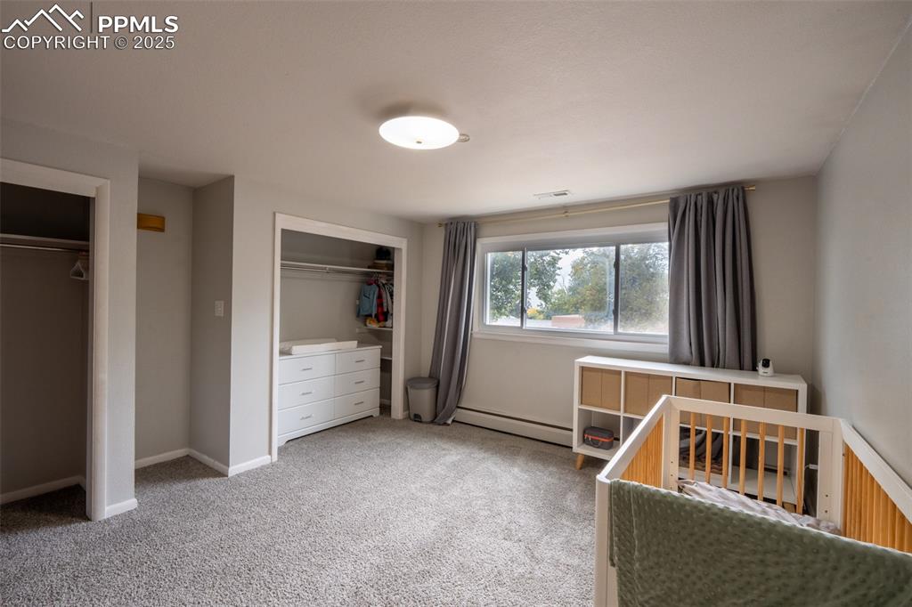 Image 16 of 49: Bedroom 1 with dual closets - upper floor