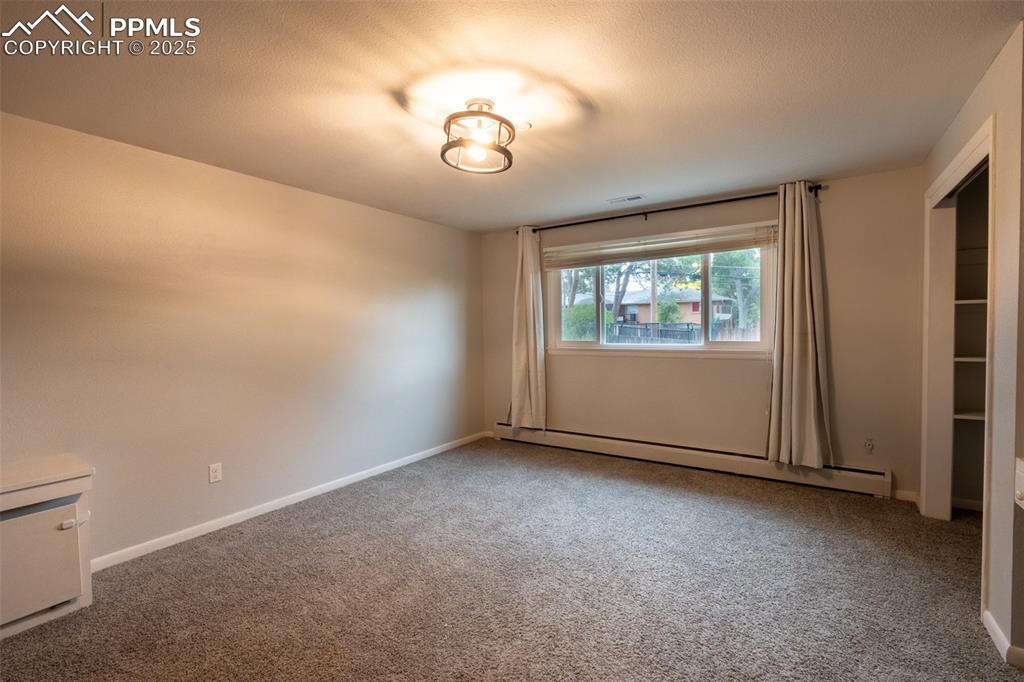 Image 17 of 49: Bedroom 2 with dual closets - upper floor