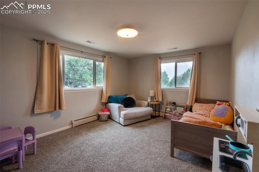 Image 19 of 49: Bedroom 3 with dual closets - upper floor