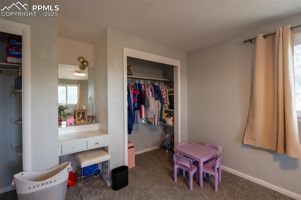 Image 21 of 49: Bedroom 3 with dual closets - upper floor