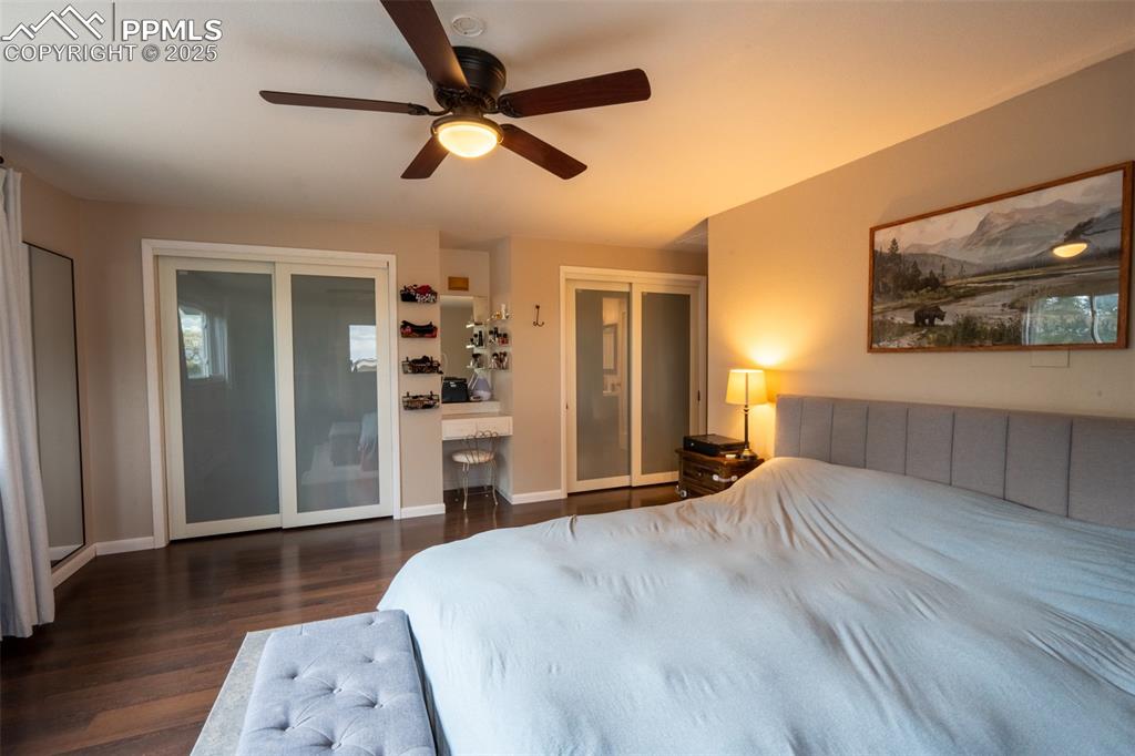 Image 25 of 49: Bedroom 4 (primary) with attached primary 3/4 bath and dual closets - upper