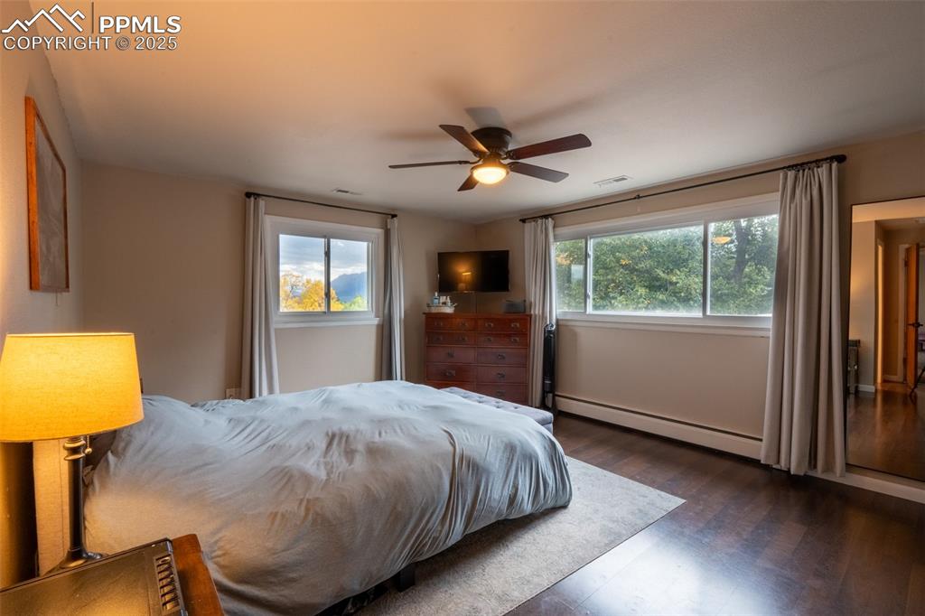 Image 26 of 49: Bedroom 4 (primary) with attached primary 3/4 bath and dual closets - upper