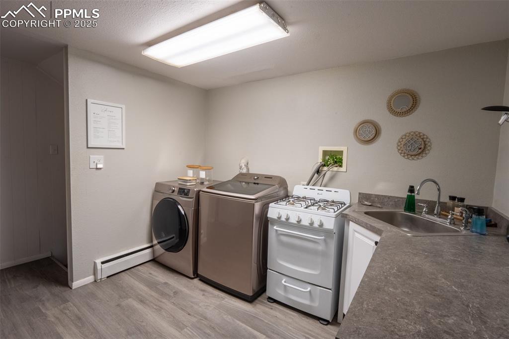 Image 31 of 49: Second kitchen and laundry - lower level (currently being used as an air B&