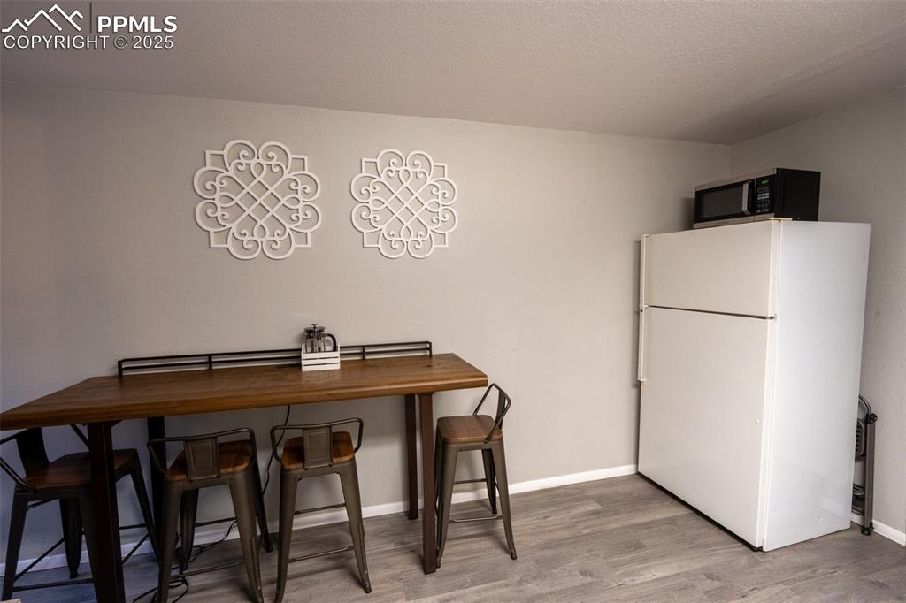 Image 32 of 49: Second kitchen and laundry - lower level (currently being used as an air B&