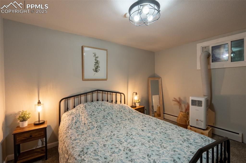 Image 40 of 49: Bedroom 5 - lower level (currently being used as an air B&B)