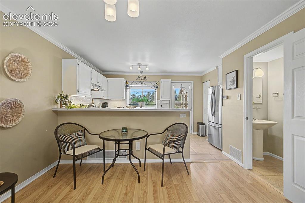 Image 10 of 31: View of dining area and kitchen