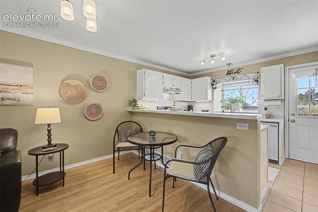 Image 11 of 31: View of dining area and kitchen