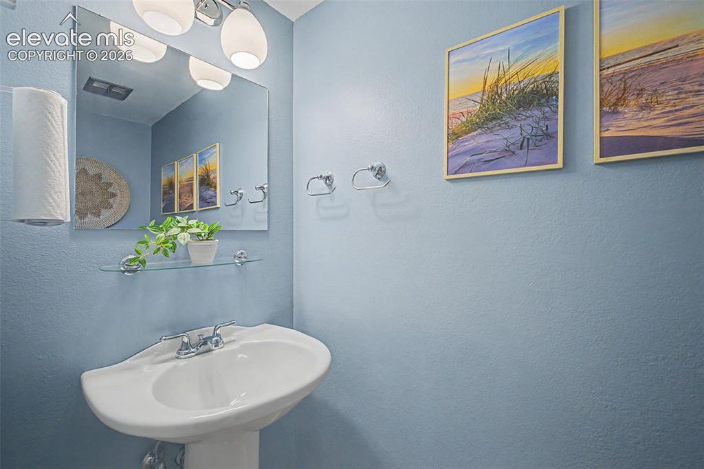 Image 17 of 31: Half bath on main floor
