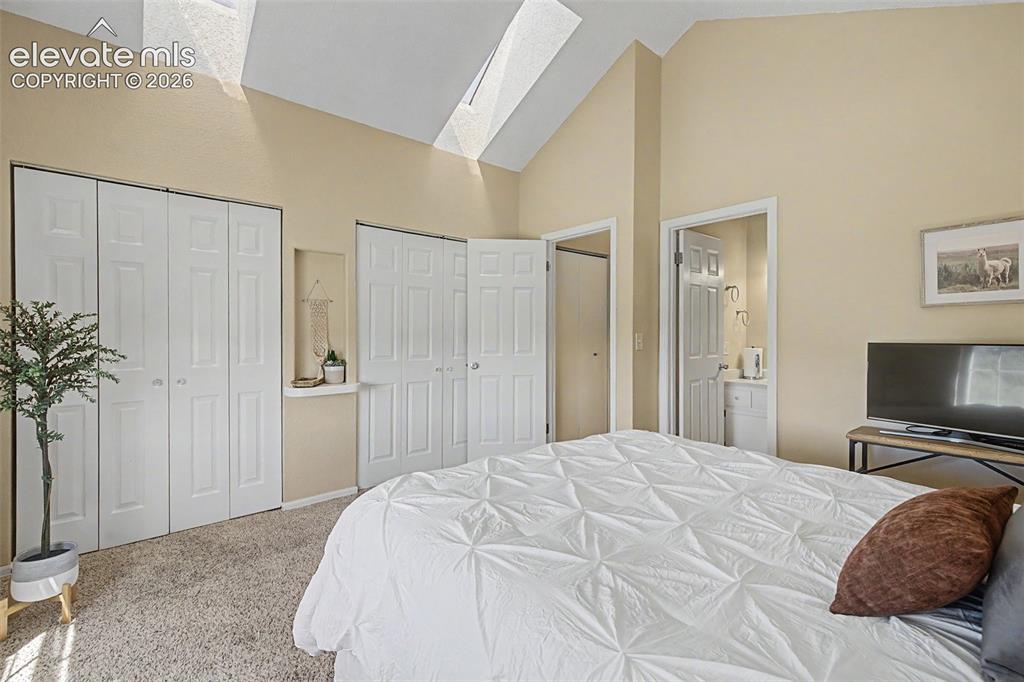 Image 20 of 31: Primary bedroom featuring two large closets
