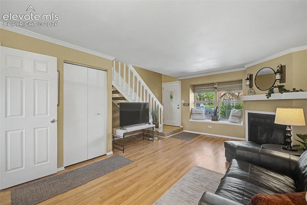 Image 7 of 31: View of living area and entry from kitchen