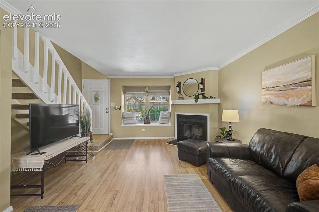 Image 8 of 31: View of living area and entry from kitchen