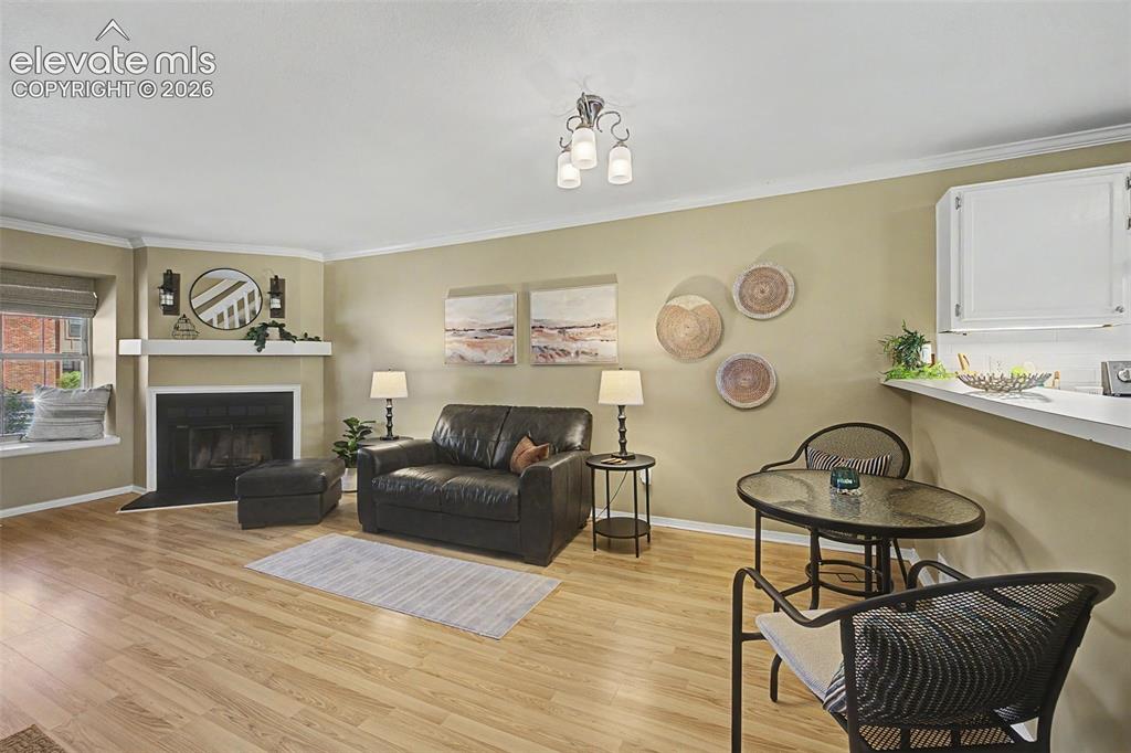 Image 9 of 31: View of living area and entry from kitchen