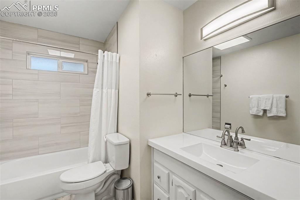 Image 7 of 23: Bathroom featuring vanity and shower / bath combo