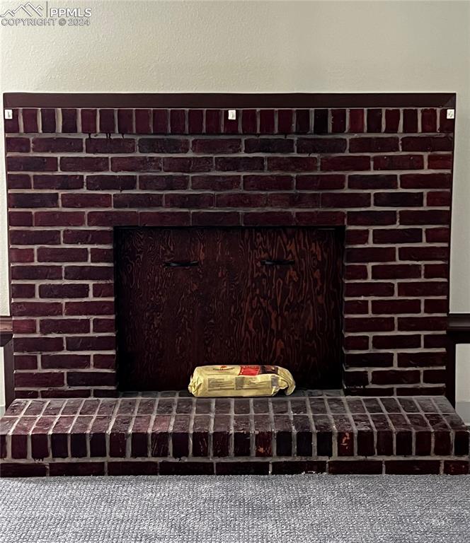 Image 15 of 23: Cozy up to the wood-burning fireplace!